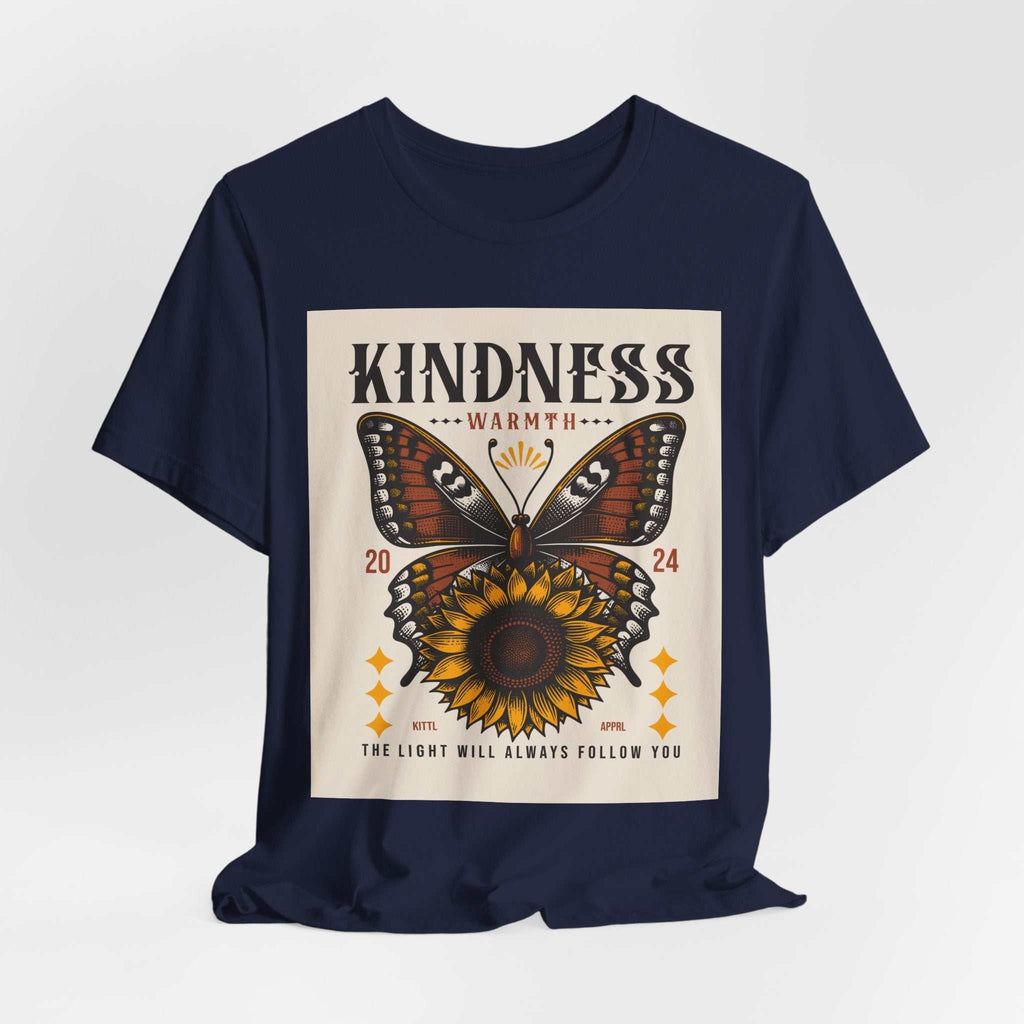 Navy t-shirt with a butterfly and sunflower design featuring the text "Kindness Warmth 2024" and "The light will always follow you"