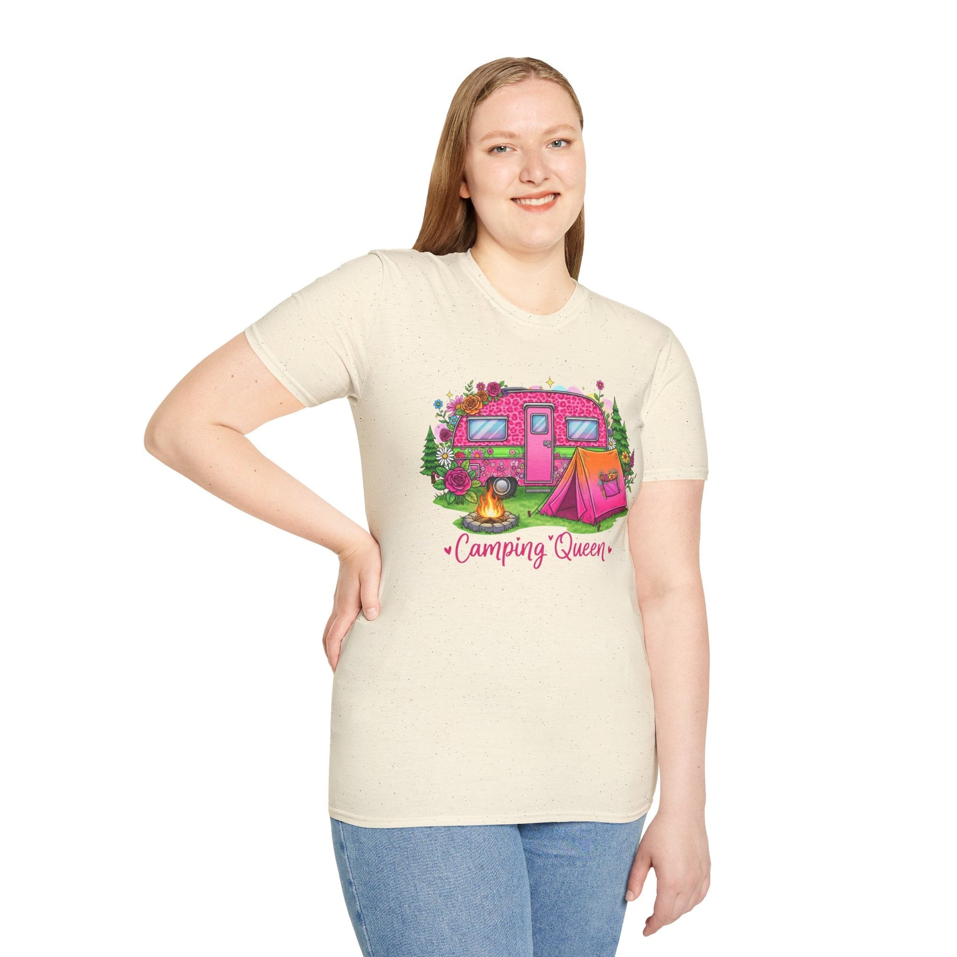 Woman wearing Camping Queen T-Shirt with pink camper, tent, campfire, and floral design on cream fabric