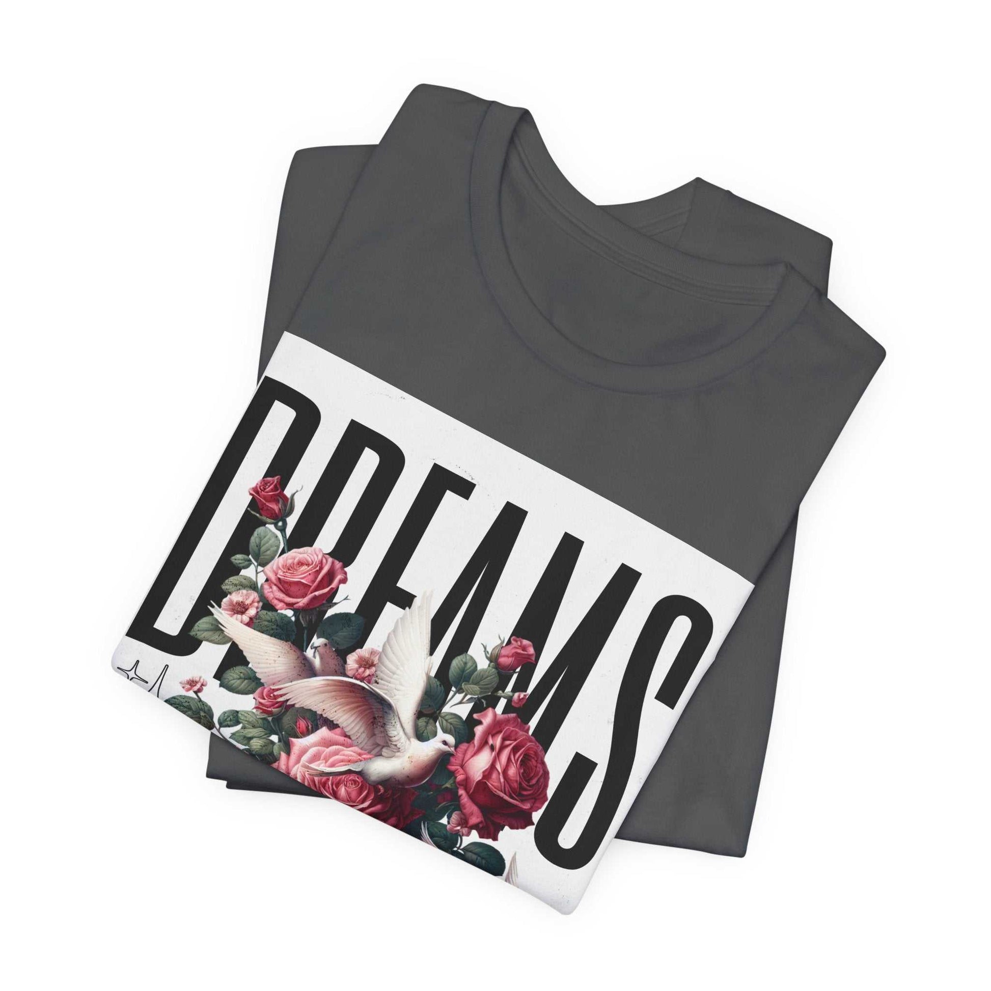 Folded gray Dreams Floral Tee with large white graphic featuring pink roses and a white bird