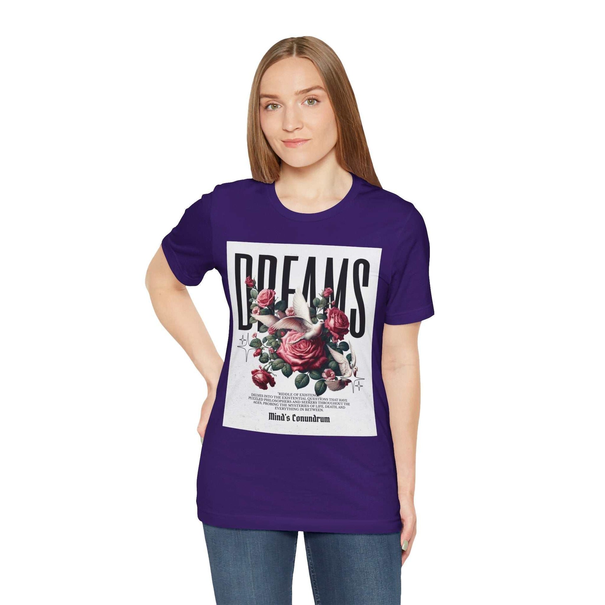 Woman wearing purple Dreams Floral Tee with bold floral graphic and typography on front