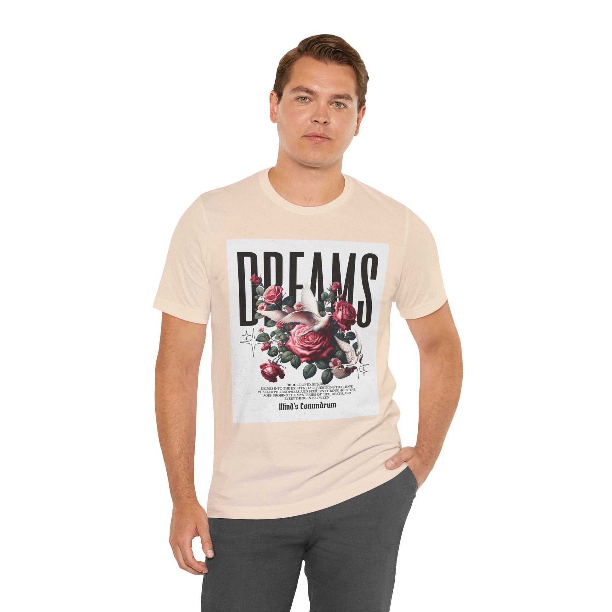 Man wearing beige Dreams Floral Tee with red rose graphic and bold "DREAMS" text on front