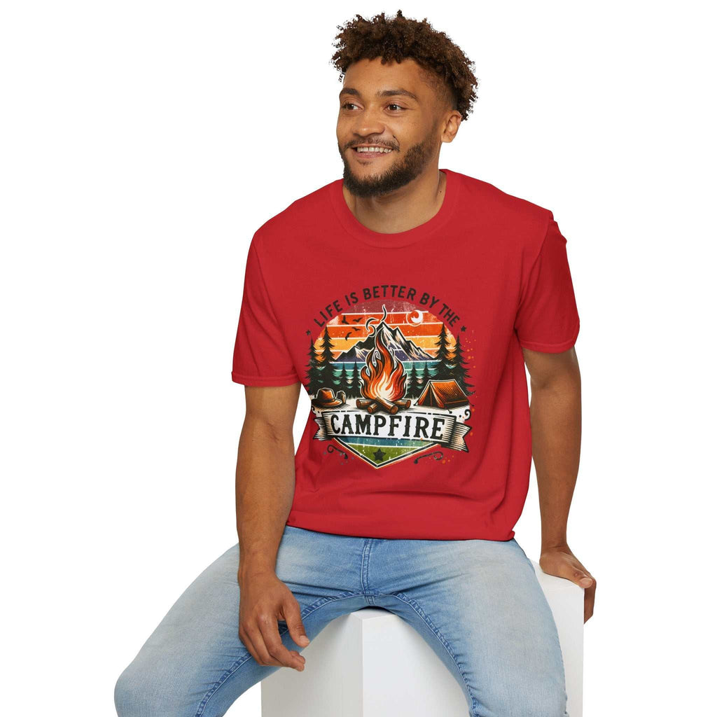 Man wearing red Camping Adventure Unisex T-Shirt with campfire design and "Life is Better by the Campfire" text