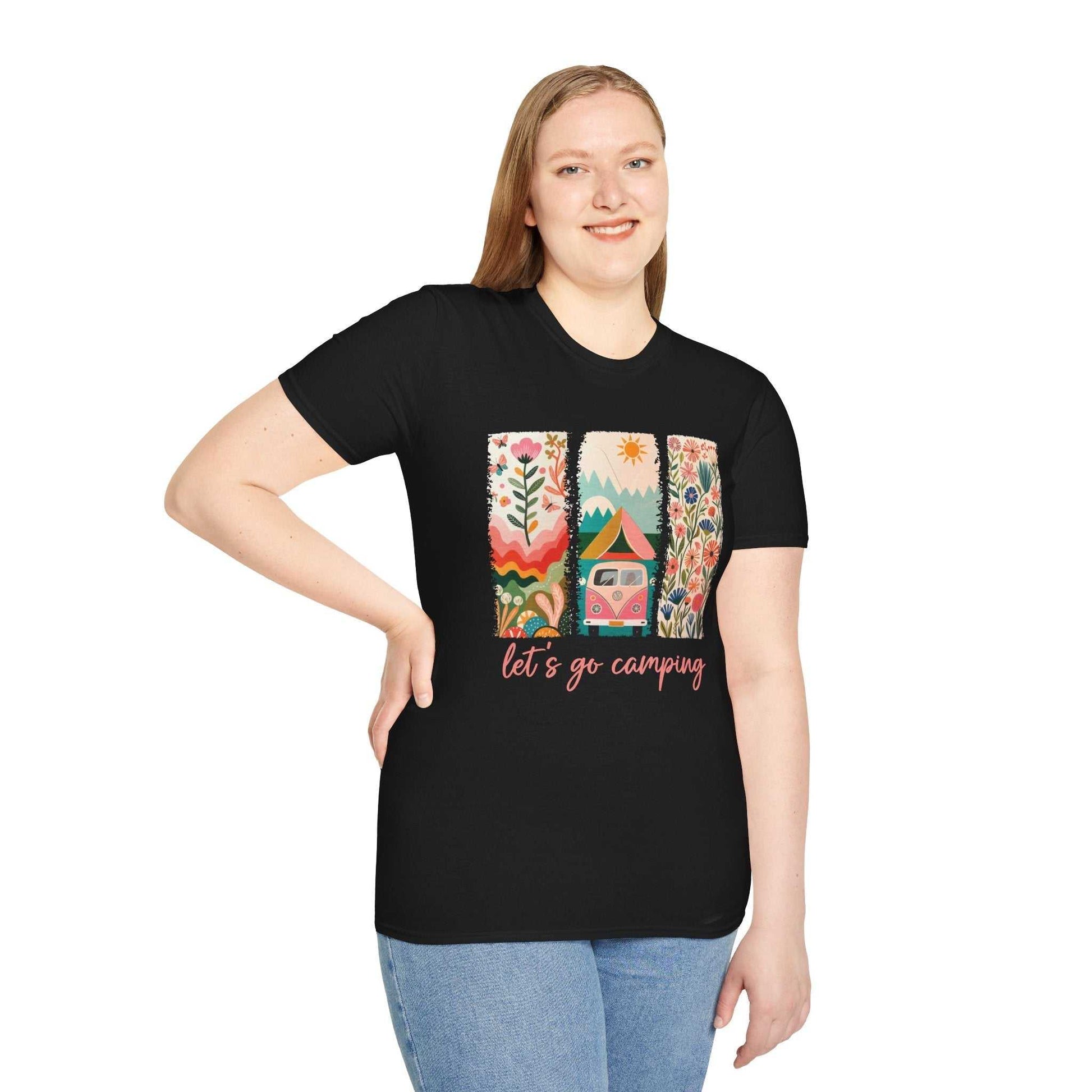 Woman wearing black Camping Adventure unisex softstyle t-shirt with colorful nature and tent design and "let's go camping" text.