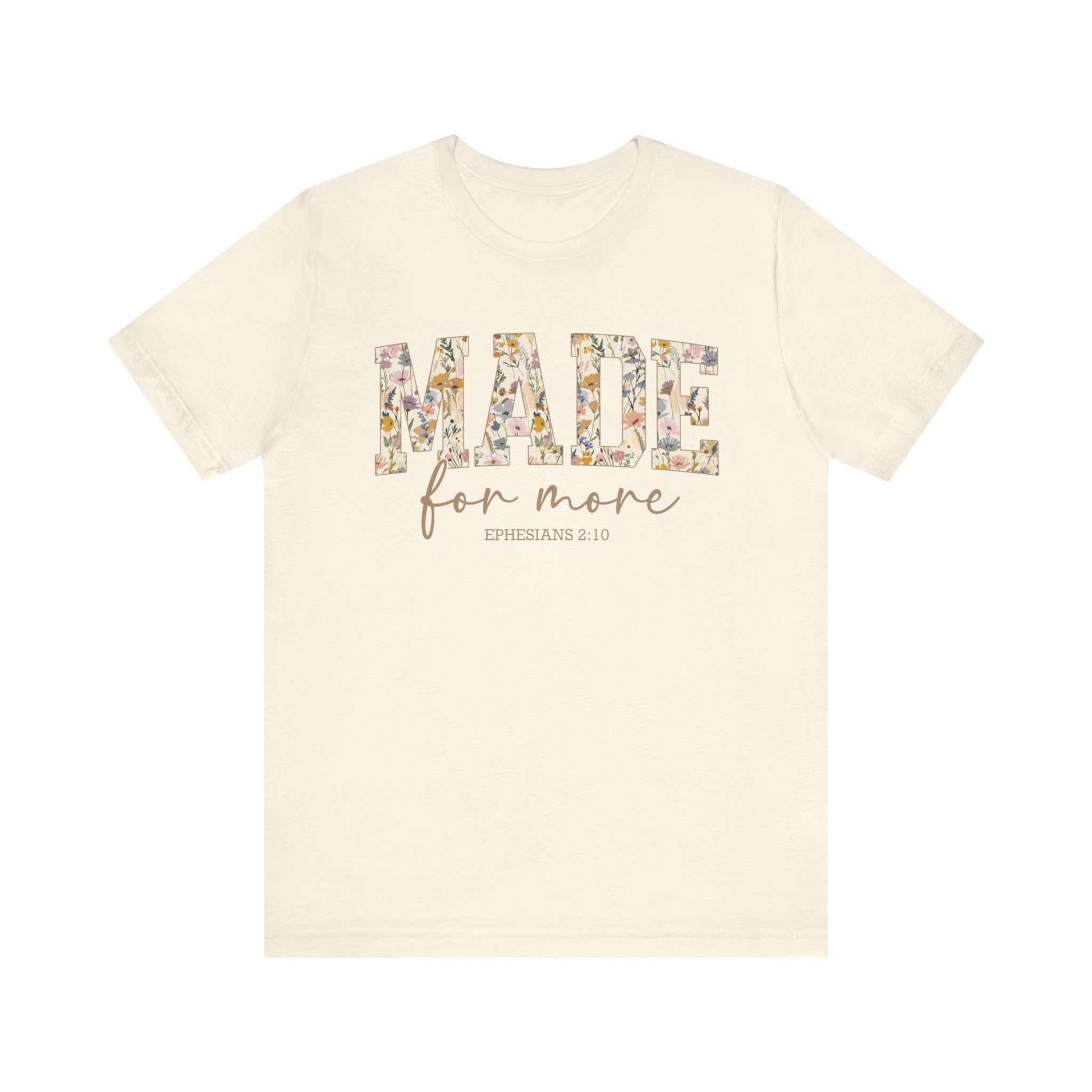 Unisex cream short sleeve tee with floral "MADE for more" text and Ephesians 2:10 scripture design
