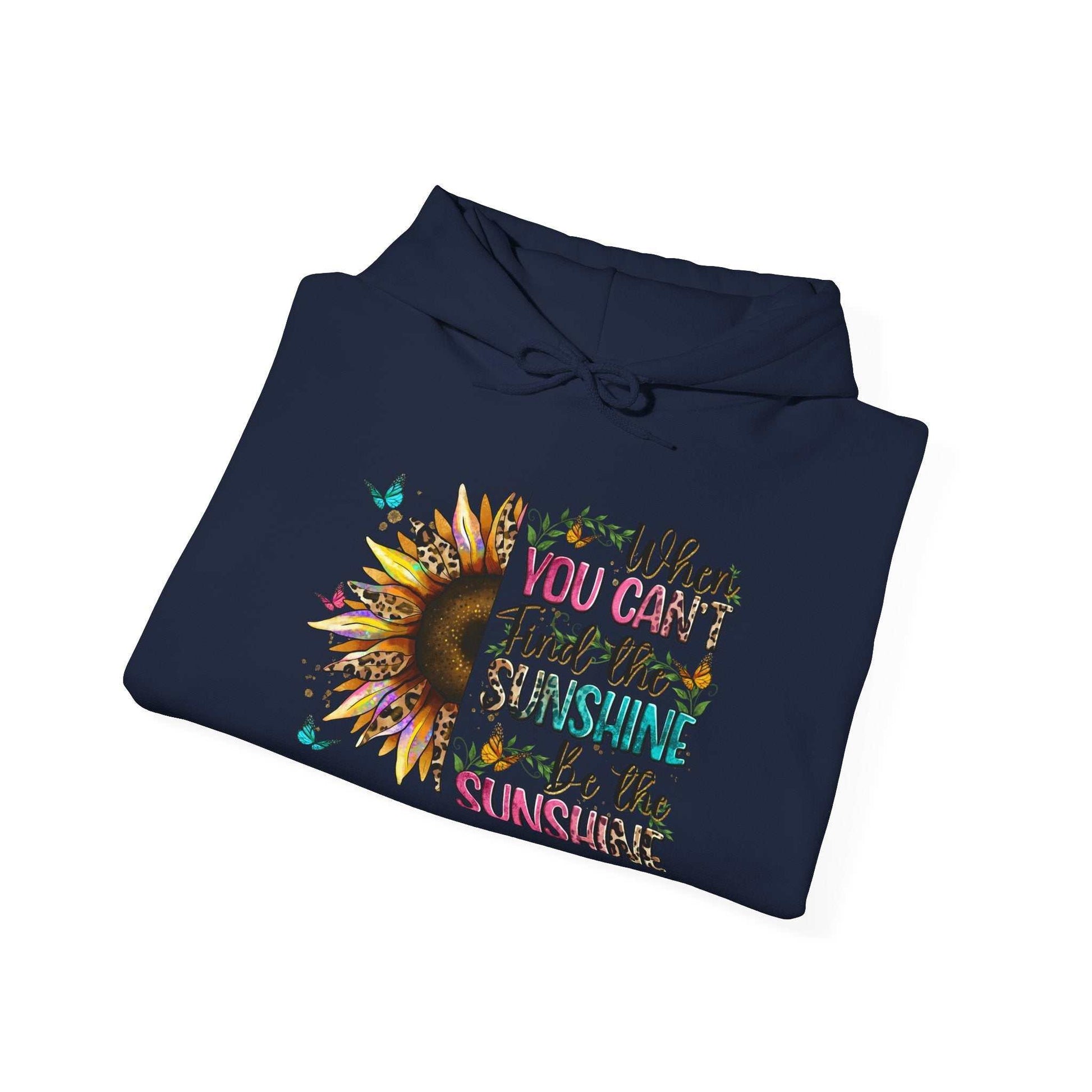 Folded navy sunflower quote hoodie with colorful inspirational text and sunflower graphic design