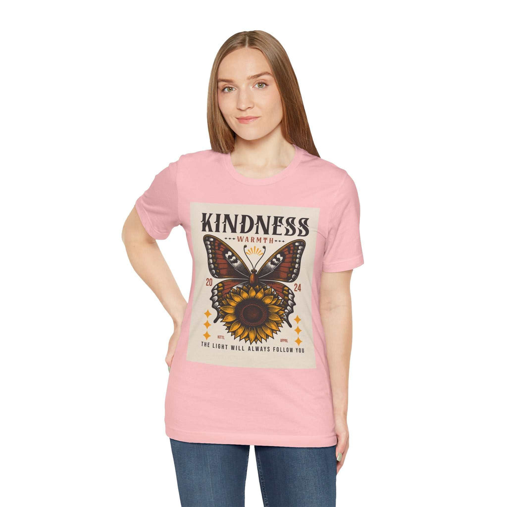 Woman wearing pink Kindness Butterfly Tee with butterfly and sunflower design and positive message on front