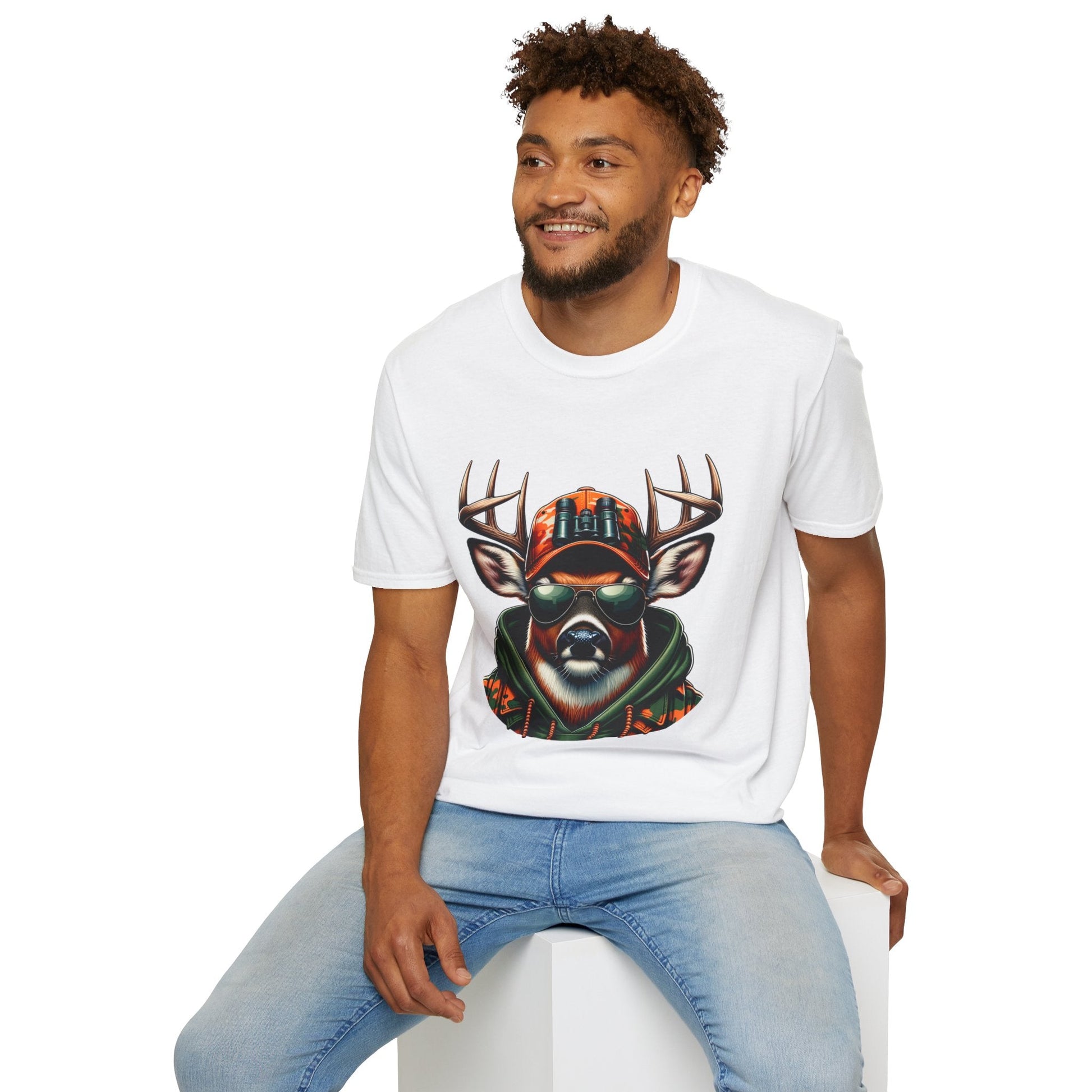 Man wearing white Hunting Enthusiast T-Shirt with deer graphic and sunglasses sitting on white block