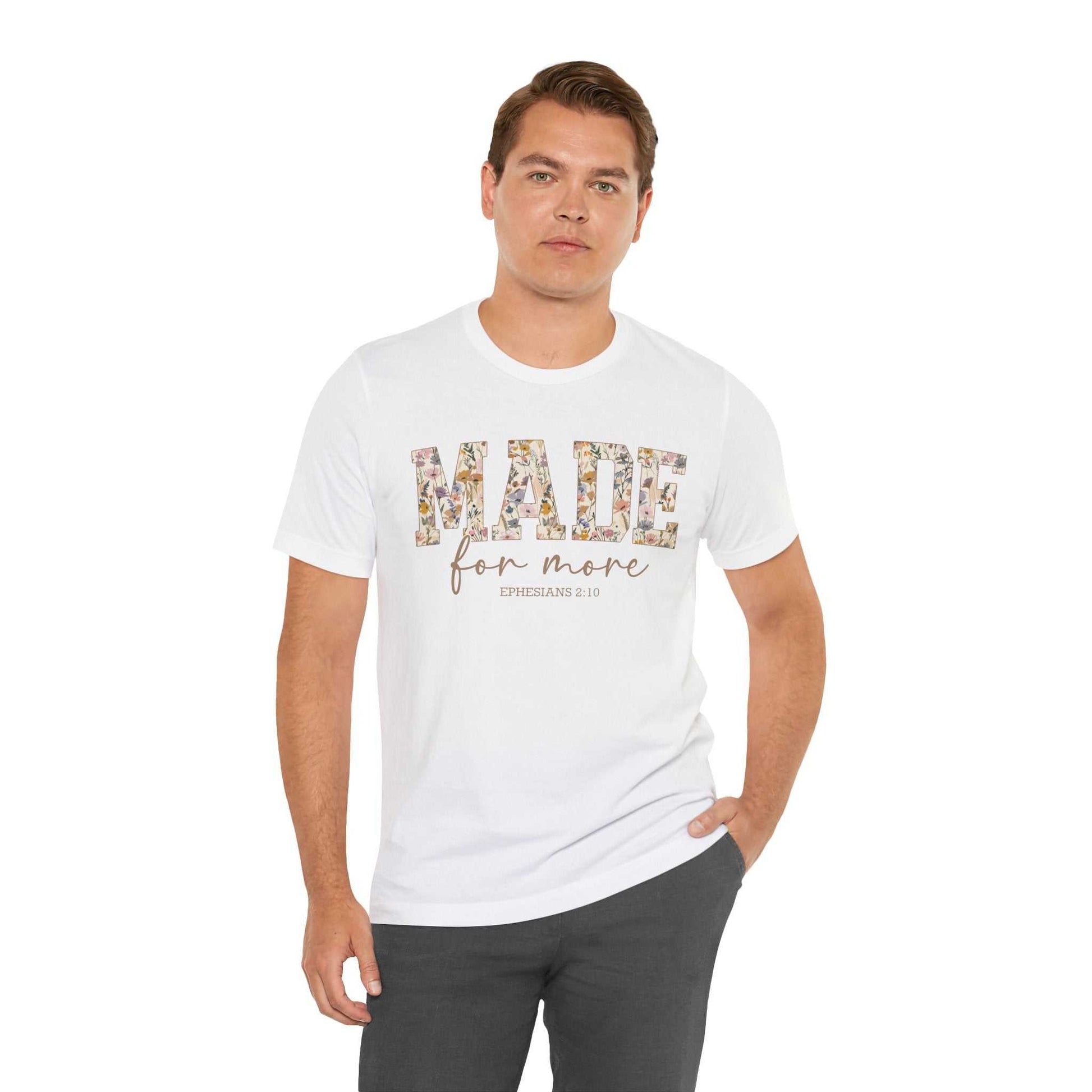 Man wearing white Made for More Tee with floral text design, casual fit, and short sleeves