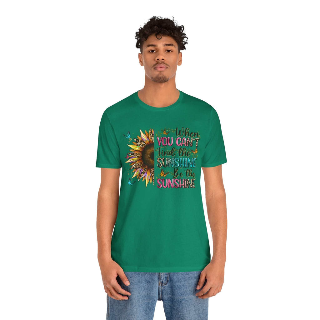 Man wearing green Sunshine Quote Tee with sunflower graphic and inspirational text on front