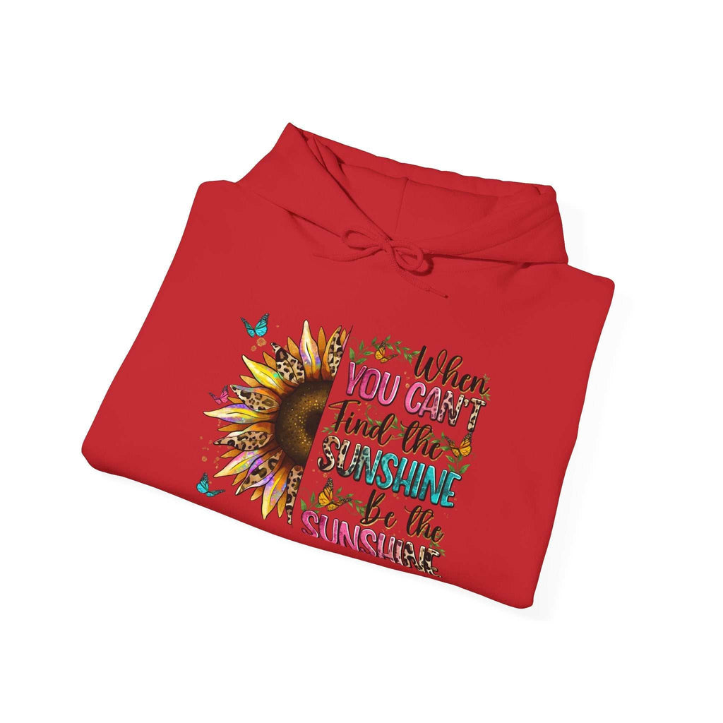 Red sunflower quote hoodie with inspirational text and butterfly accents, folded flat.